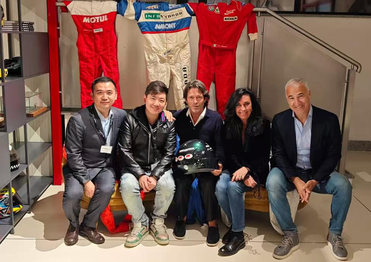 Team photo with racing suits display